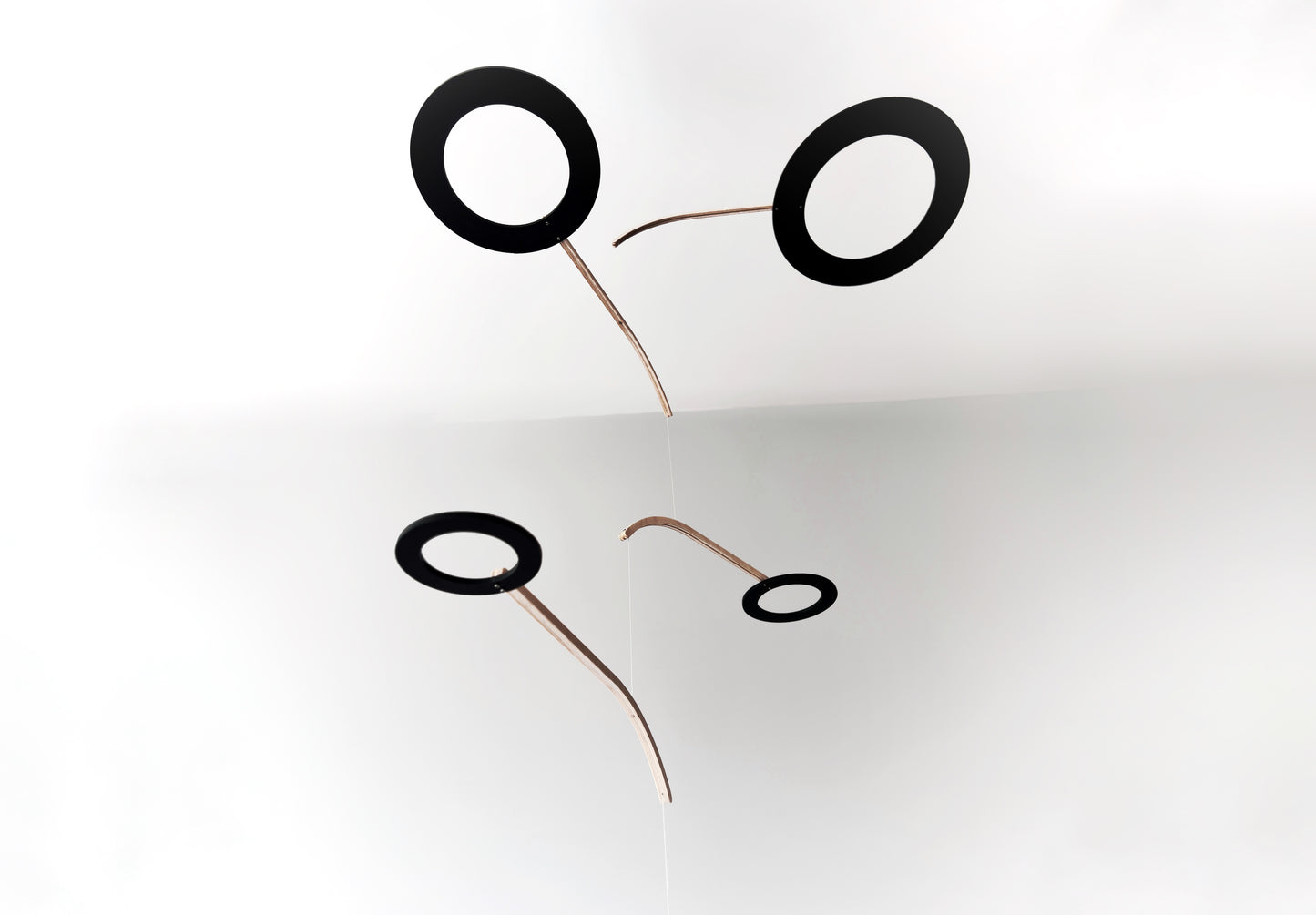 Large Kinetic Mobile Sculpture, Black Hanging Adult Mobile, Mid Century Modern Art Mobile, Calder Minimal Circle Mobile, Halo The Illuminist
Introducing Halo Mobile - A stunning piece of kinetic art that will bring movement and joy to any room. Handcrafted from responsibly sourced engineered birch, this unique mobile features six halo rings of increasing width and size in frosted black acrylic.