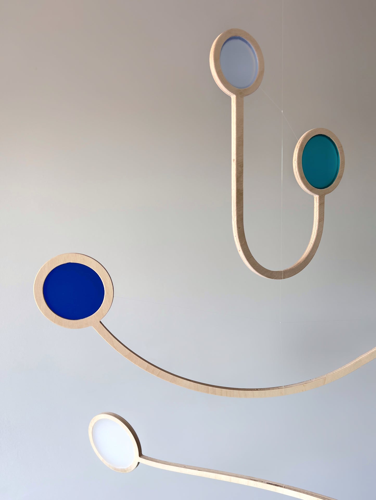 Wooden Hanging Kinetic Mobile Sculpture. Adult & Baby Mobile. Custom Colour Mid Century Calder Mobile, Scandi Nursery Home Decor. Supernova Mobile.
Wooden and colourful acrylic mobile. Influenced by Calder mobiles and the mid-century modern movement. A beautiful piece of moving handmade hanging art.
An ideal fit for an infant’s room, a stairwell, Home Office, Living-room, dorm room or in a feature window - What a perfect gift.