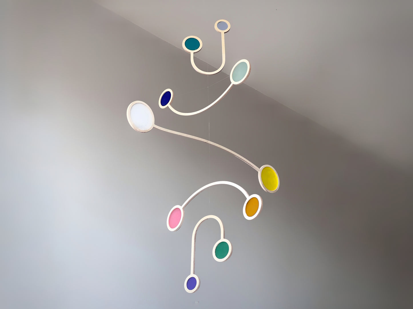Wooden Hanging Kinetic Mobile Sculpture. Adult & Baby Mobile. Custom Colour Mid Century Calder Mobile, Scandi Nursery Home Decor. Supernova Mobile.
Wooden and colourful acrylic mobile. Influenced by Calder mobiles and the mid-century modern movement. A beautiful piece of moving handmade hanging art.
An ideal fit for an infant’s room, a stairwell, Home Office, Living-room, dorm room or in a feature window - What a perfect gift.