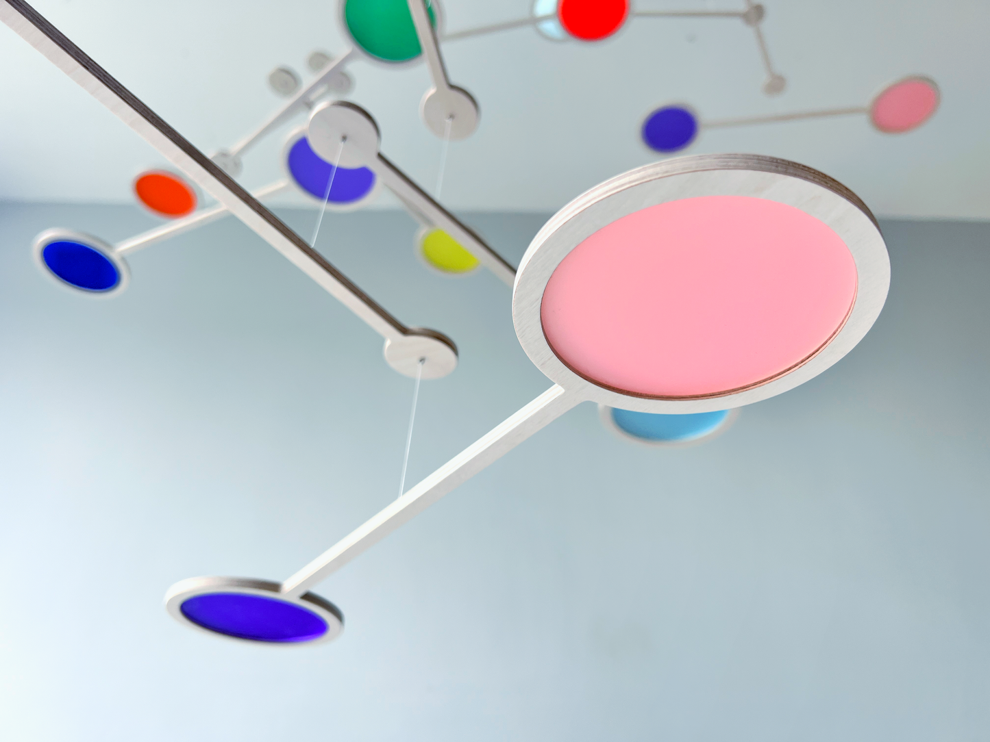 Tripple Orbit Mobile - Add bold colour, movement, and modern style to your home with the Large Tripple Orbit Mobile – a handcrafted hanging decoration made from premium plywood and vibrant acrylic discs. This kinetic ceiling sculpture is perfect for adding a contemporary home accessory to your space, blending mid-century modern, minimalist, and art-inspired decor aesthetics.