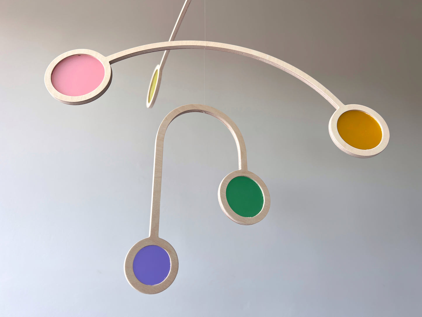 Wooden Hanging Kinetic Mobile Sculpture. Adult & Baby Mobile. Custom Colour Mid Century Calder Mobile, Scandi Nursery Home Decor. Supernova Mobile.
Wooden and colourful acrylic mobile. Influenced by Calder mobiles and the mid-century modern movement. A beautiful piece of moving handmade hanging art.
An ideal fit for an infant’s room, a stairwell, Home Office, Living-room, dorm room or in a feature window - What a perfect gift.