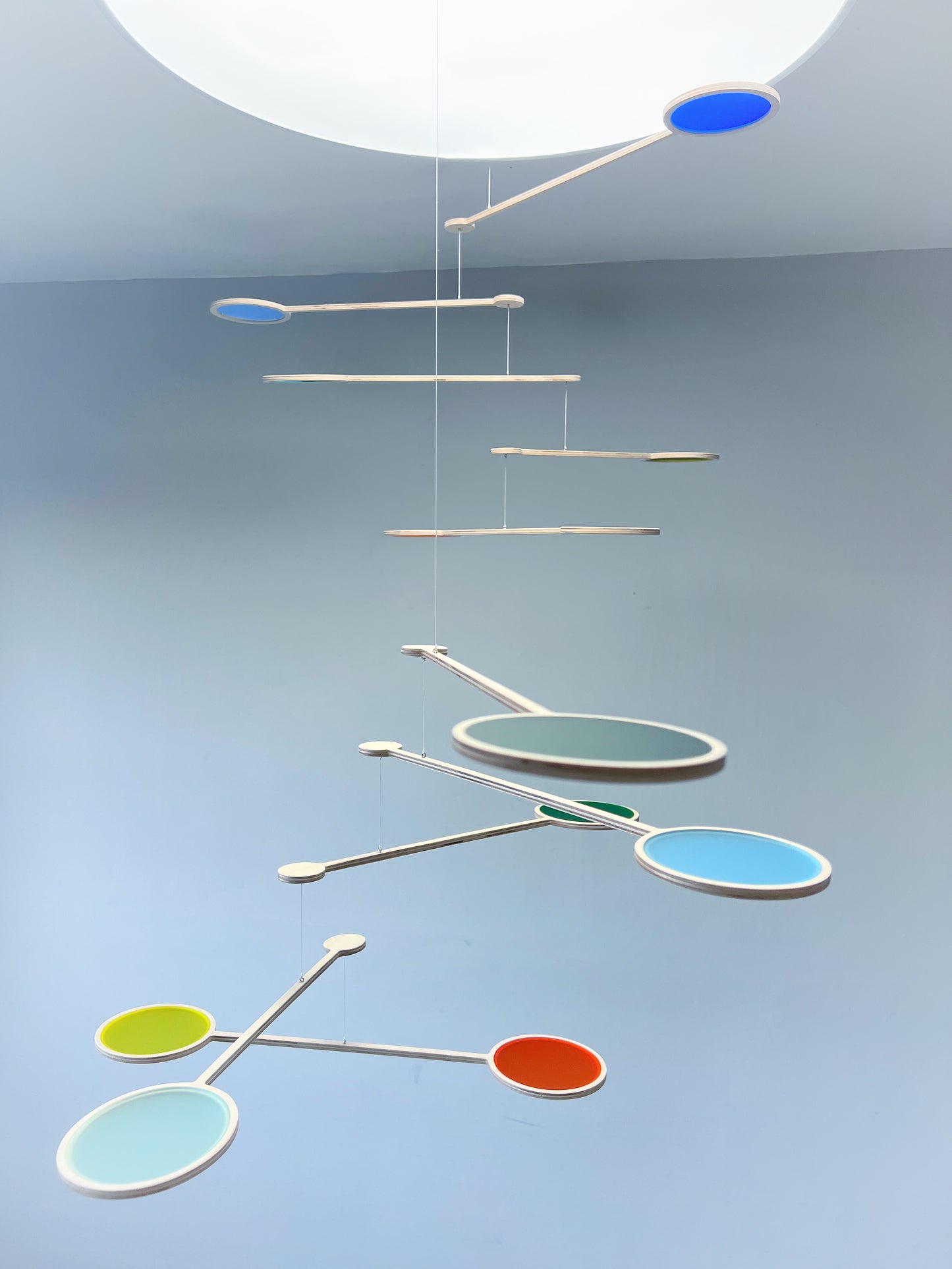 Large Kinetic Custom Mobile Sculpture. Mid Century Modern Calder Bespoke Hanging Art. Adult & Baby Nursery Mobile, Colourful Orbit - Choose your own colours mobile
Wooden and colourful acrylic mobile. Influenced by Calder mobiles and the mid-century modern movement. A beautiful piece of moving hanging art.
Double form orbit mobile at tiered height, hanging from 2 strings, creating one kinetic form.
Both Orbit mobiles together hang approximately 80cm from the ceiling at their lowest point. Singular Orbi