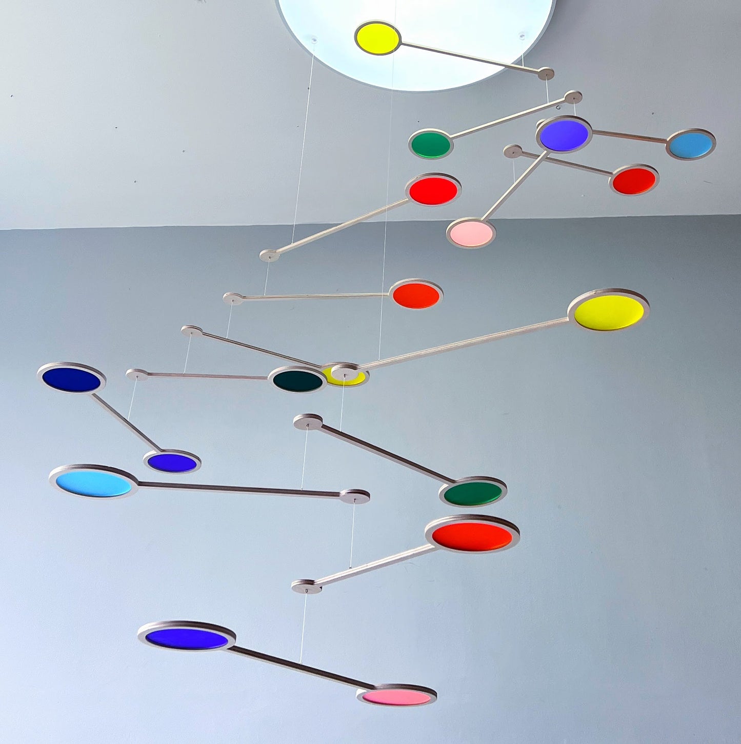 Tripple Orbit Mobile - Add bold colour, movement, and modern style to your home with the Large Tripple Orbit Mobile – a handcrafted hanging decoration made from premium plywood and vibrant acrylic discs. This kinetic ceiling sculpture is perfect for adding a contemporary home accessory to your space, blending mid-century modern, minimalist, and art-inspired decor aesthetics.