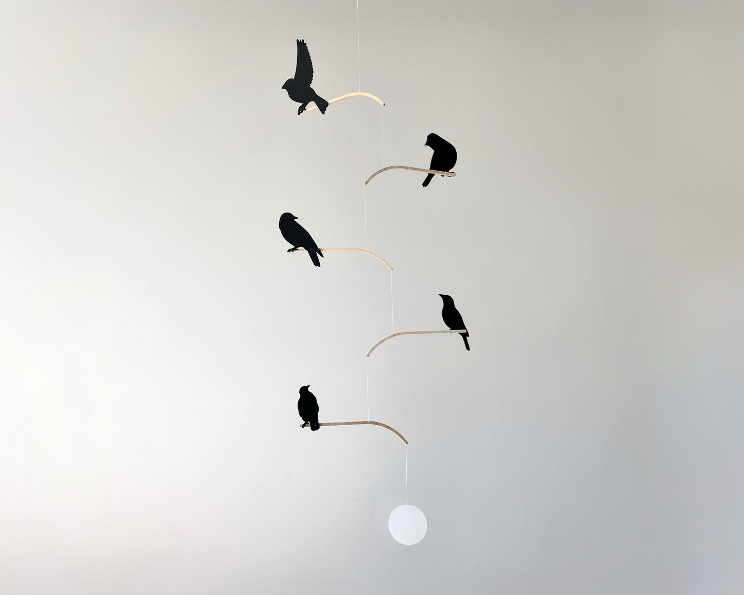 Nosey Bird Kinetic Mobile Sculpture, Adult & Baby Mobile. Hanging Silhouette Wall Art, Counterbalanced Handcrafted Acrylic & Wood Bird Mobile

Introducing ‘Nosey Birds’ - A fun piece of kinetic art that will bring movement and interest to any room. Handcrafted from responsibly sourced engineered birch, this unique mobile features 5 laser cut bird silhouettes of increasing size in a stunning frosted black acrylic. Composed so the birds are looking towards each other while perched on the curved birch arm.