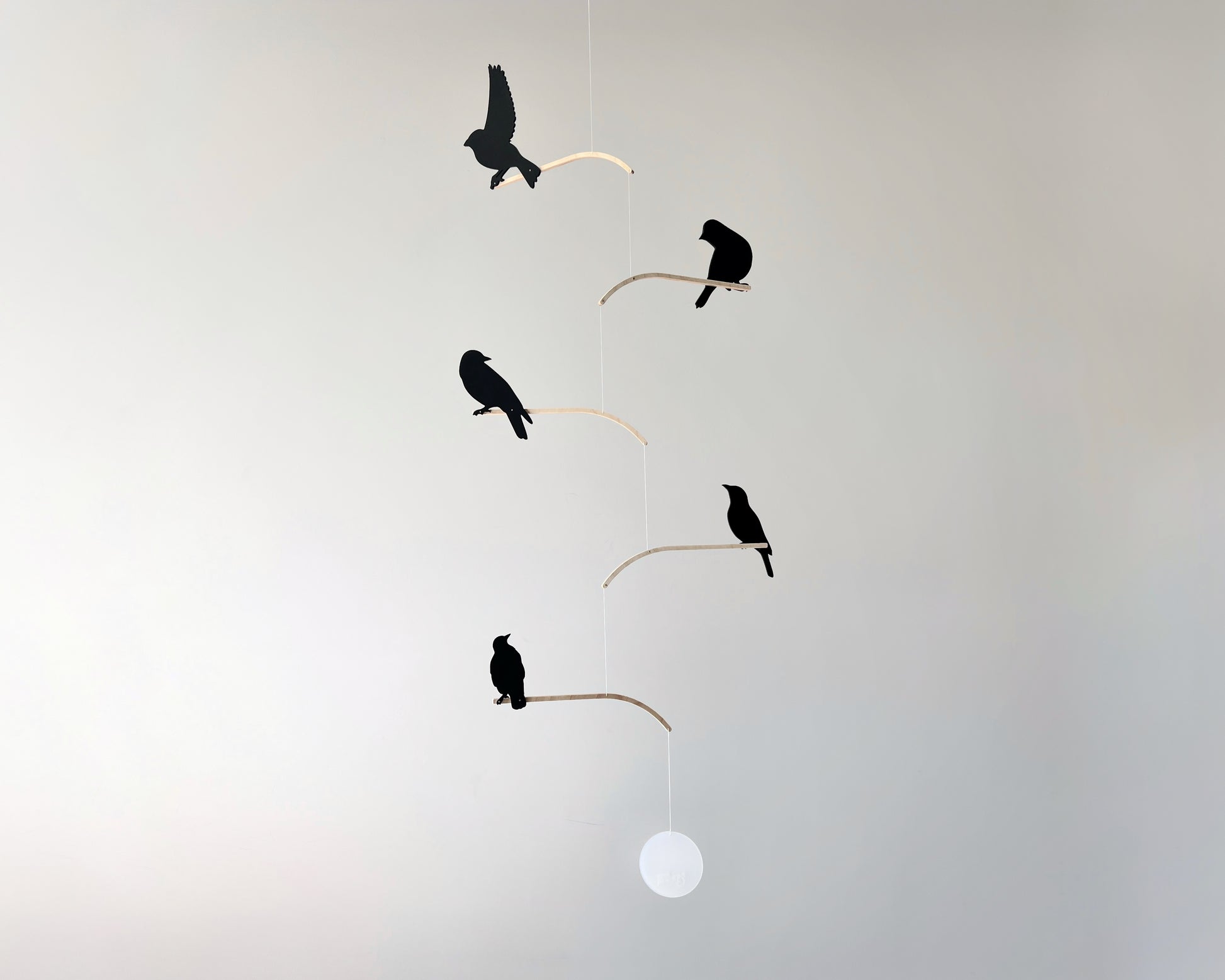 Nosey Bird Kinetic Mobile Sculpture, Adult & Baby Mobile. Hanging Silhouette Wall Art, Counterbalanced Handcrafted Acrylic & Wood Bird Mobile

Introducing ‘Nosey Birds’ - A fun piece of kinetic art that will bring movement and interest to any room. Handcrafted from responsibly sourced engineered birch, this unique mobile features 5 laser cut bird silhouettes of increasing size in a stunning frosted black acrylic. Composed so the birds are looking towards each other while perched on the curved birch arm.