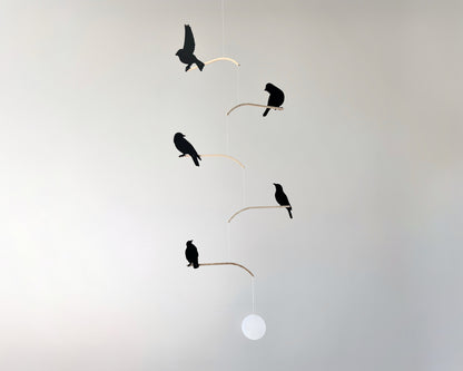Nosey Bird Kinetic Mobile Sculpture, Adult & Baby Mobile. Hanging Silhouette Wall Art, Counterbalanced Handcrafted Acrylic & Wood Bird Mobile

Introducing ‘Nosey Birds’ - A fun piece of kinetic art that will bring movement and interest to any room. Handcrafted from responsibly sourced engineered birch, this unique mobile features 5 laser cut bird silhouettes of increasing size in a stunning frosted black acrylic. Composed so the birds are looking towards each other while perched on the curved birch arm.