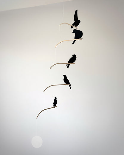 Nosey Bird Kinetic Mobile Sculpture, Adult & Baby Mobile. Hanging Silhouette Wall Art, Counterbalanced Handcrafted Acrylic & Wood Bird Mobile

Introducing ‘Nosey Birds’ - A fun piece of kinetic art that will bring movement and interest to any room. Handcrafted from responsibly sourced engineered birch, this unique mobile features 5 laser cut bird silhouettes of increasing size in a stunning frosted black acrylic. Composed so the birds are looking towards each other while perched on the curved birch arm.
