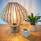 "Wooden midcentury table lamp," "Retro wooden desk lamp," "Vintage wooden bedside lamp," "Modern wooden table light," "Minimalist wood lamp," "Sleek wooden desk light," "Contemporary wood table lamp," "Scandinavian wooden lamp," "Elegant wood bedside light." These terms should cover a range of styles and preferences for wooden midcentury table lamps.