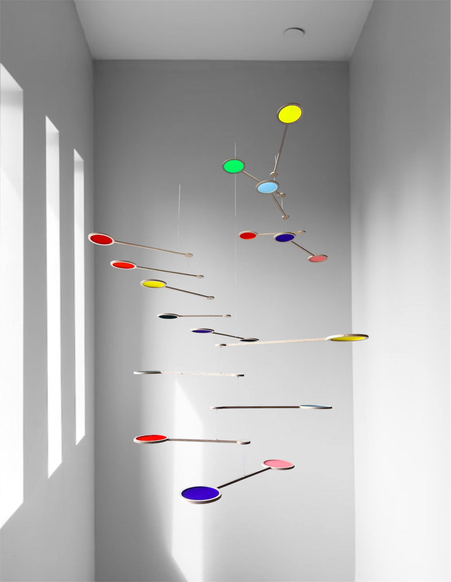 Tripple Orbit Mobile - Add bold colour, movement, and modern style to your home with the Large Tripple Orbit Mobile – a handcrafted hanging decoration made from premium plywood and vibrant acrylic discs. This kinetic ceiling sculpture is perfect for adding a contemporary home accessory to your space, blending mid-century modern, minimalist, and art-inspired decor aesthetics.