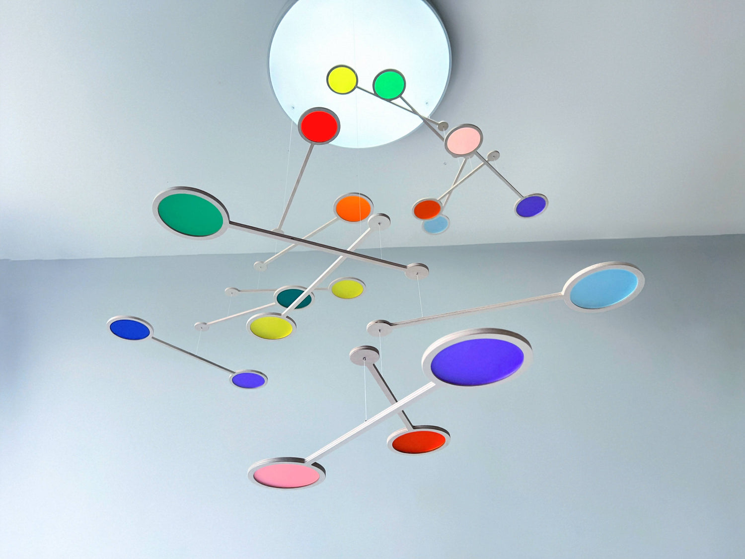 Tripple Orbit Mobile - Add bold colour, movement, and modern style to your home with the Large Tripple Orbit Mobile – a handcrafted hanging decoration made from premium plywood and vibrant acrylic discs. This kinetic ceiling sculpture is perfect for adding a contemporary home accessory to your space, blending mid-century modern, minimalist, and art-inspired decor aesthetics.