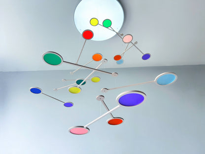 Tripple Orbit Mobile - Add bold colour, movement, and modern style to your home with the Large Tripple Orbit Mobile – a handcrafted hanging decoration made from premium plywood and vibrant acrylic discs. This kinetic ceiling sculpture is perfect for adding a contemporary home accessory to your space, blending mid-century modern, minimalist, and art-inspired decor aesthetics.