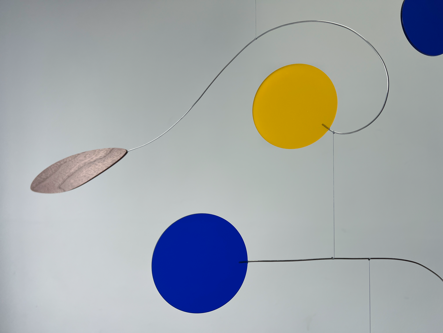 Abstract art piece with colored circles and lines on a white background Rise MOBILE - Mid century Kinetic mobile sculpture In walnut and acrylic inspired by Calder 
