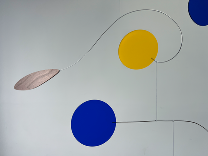 Abstract art piece with colored circles and lines on a white background Rise MOBILE - Mid century Kinetic mobile sculpture In walnut and acrylic inspired by Calder 