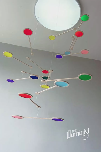 Tripple Orbit Mobile - Add bold colour, movement, and modern style to your home with the Large Tripple Orbit Mobile – a handcrafted hanging decoration made from premium plywood and vibrant acrylic discs. This kinetic ceiling sculpture is perfect for adding a contemporary home accessory to your space, blending mid-century modern, minimalist, and art-inspired decor aesthetics.