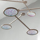 Orbit Iridescent Diachronic Mobile - The Illuminist - Mobiles Kinetic Mobile Kinetic Art  Kinetic Sculpture Crib Mobile Baby Mobile Nursery Mobile Mobile Art Mid Century Art  Mid Century modern Calder mobile mobiles for adults furniture and decor Hanging Art Mobile Art spinning mobile Modern Art Contemporary Art  Hanging mobile Calder-inspired