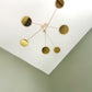 Orbit Mobile - The Illuminist - Gold Brass mirror  Mobiles Kinetic Mobile Kinetic Art  Kinetic Sculpture Crib Mobile Baby Mobile Nursery Mobile Mobile Art Mid Century Art  Mid Century modern Calder mobile mobiles for adults furniture and decor Hanging Art Mobile Art spinning mobile Modern Art Contemporary Art  Hanging mobile Calder-inspired. 
